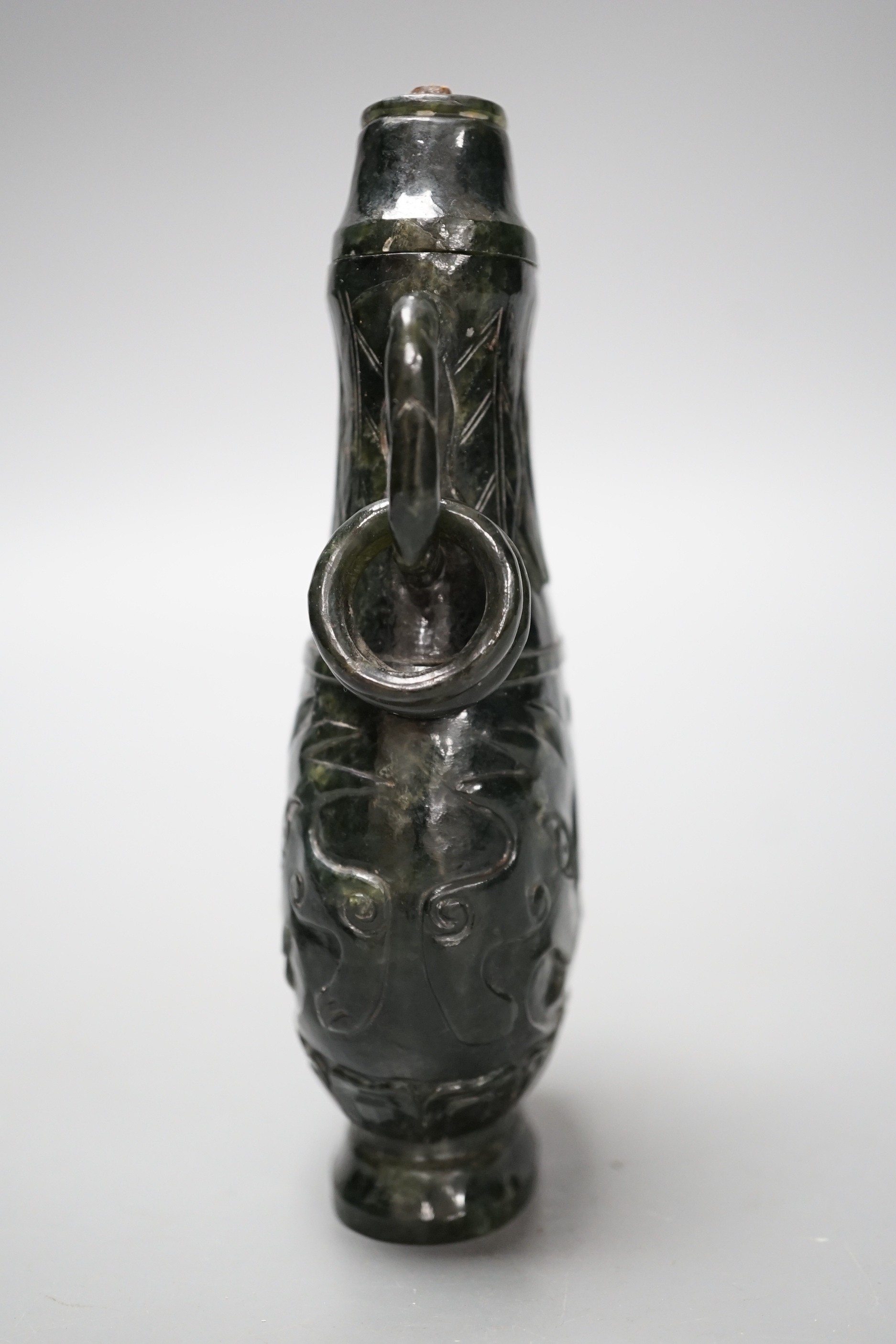 A Chinese archaistic carved hardstone vase and cover. 15cm high.